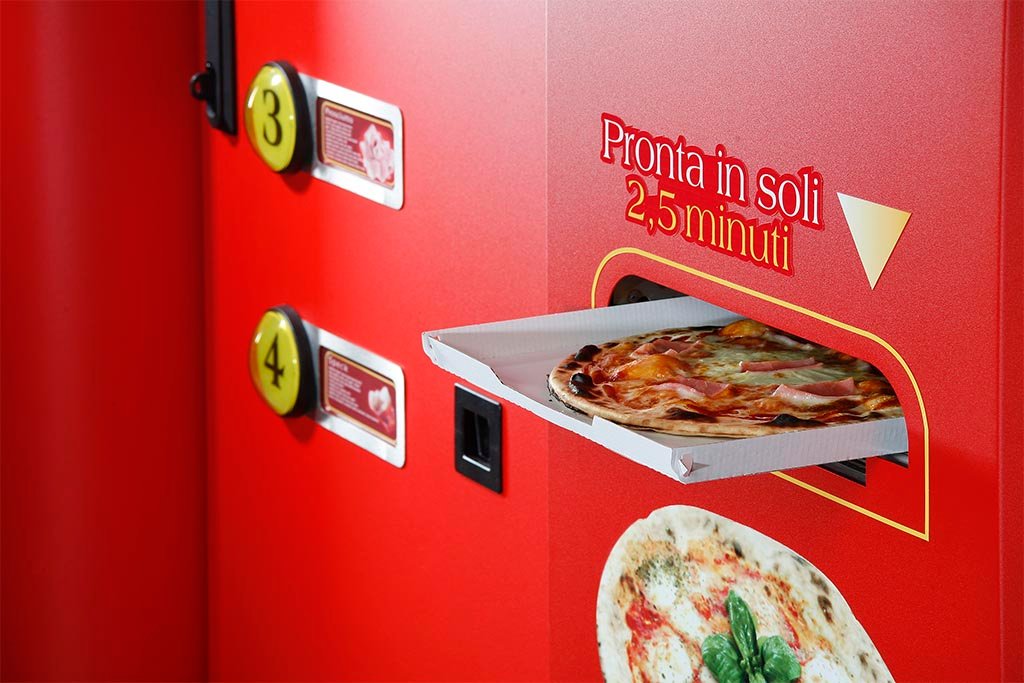 Hot freshly baked pizza ready for collection from an automatic vending machine